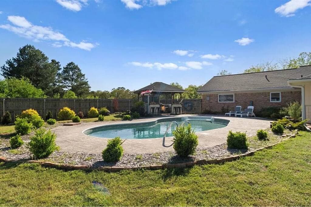 Outdoor pool area at Old Broken Bow Highway cabin